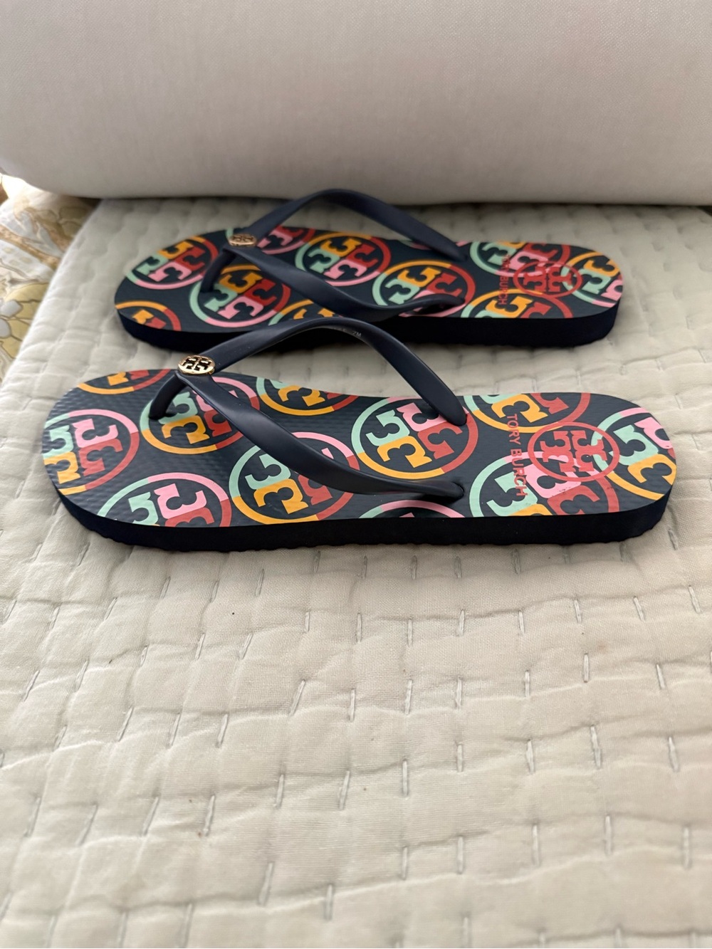 New Tory Burch Navy Strap Flip Flops with Multicolor Logo Print navy base color. - Picture 4 of 10